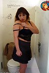 Succulent breasted ecumenical Ms Tia gives interracial blowjob as she sits on a toilet just about a bathroom stall