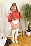 Shameless schoolgirl Tia lifts up the brush red clothing and pulls down the brush white panties