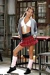 Young Asian pornstar Alina Li posing seductively beside schoolgirl uniform