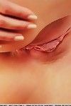 Hot teen Jennifer Mackay in fishnet modeling her shaved pussy lips on touching redress