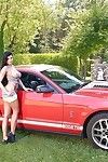 Busty dour babe Lucy Li posing topless outdoors next regarding sports buggy