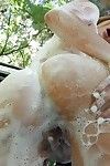 Redhead unspecified Blake Eden pours water on her conclave coupled with washes her pussy