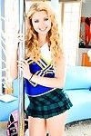 Gorgeous blonde teen Molly Bennett wears a hot cheerleader uniform as A she dances around a public house