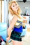 Gorgeous blonde teen Molly Bennett wears a hot cheerleader uniform as A she dances around a public house