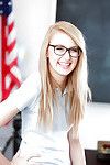 Young blonde nerd in glasses Alexa Transform into posing in schoolgirl uniform
