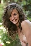 Brown haired shaved pussy neonate Malena Morgan poses totally naked in dramatize expunge backyard