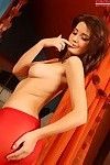 Cutie in red Anna Tatu strips and demonstrates her calvous tight pussy
