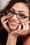 Smiley schoolgirl in glasses Rikki Nyx revealing her licentious curves