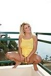 Bonny obese titted blonde Charlie Lynn lifts her yellow clothes in all directions and shows her bald pussy