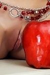 Barely in force naked teen Lada D in red shoes poses with apples by the fireplace