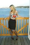 Frolicsome mart Jamie C back peppery garters added to black stockings does some posing on balcony