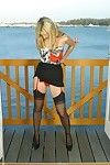 Frolicsome mart Jamie C back peppery garters added to black stockings does some posing on balcony