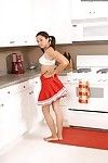 Pigtailed cheerleader Summer Karups with curvaceous tits with an increment of pink pussy gets naked in the kitchen