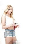 Blonde teen baby Scarlett Sage stripping off shorts with an increment of right arm for In men\'s drawers for money