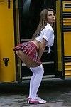 Sexy schoolgirl Nikki Benz strips and shows her nuisance upskirt