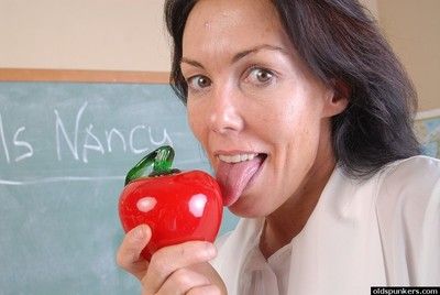Naughty granny Nancy gets completely naked in the school room
