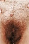 Very old granny is showing her hairy pussy and tiny tits