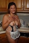 Experienced blonde lady Ivee showing off thong adorned butt in kitchen