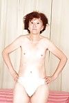 Redhead granny Marcelina shows herself naked in the bedroom!