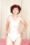 Redhead granny Marcelina shows herself naked in the bedroom!