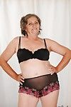Naughty granny with fatty curves getting rid of her lingerie