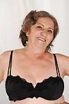 Naughty granny with fatty curves getting rid of her lingerie