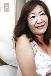 Asian granny Michiko Okawa undressing and exposing her hairy twat in close up