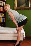 Smiley short-haired granny with ample ass gets rid of her clothes