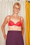Lecherous granny with shaved twat stripping and spreading her legs