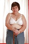 Lecherous granny with massive flabby jugs stripping and exposing her twat