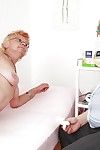Short-haired granny in stockings getting her twat examed and pissing