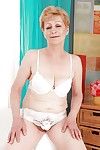 Short haired blonde granny with flabby jugs stripping off her clothes