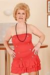 Big busted granny on high heels stripping off her dress and posing naked