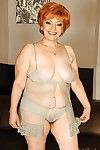 Busty granny on high heels shows her fatty body and her hairy cunt