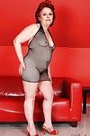 Fatty granny in a fishnet dress spreading her hairy cunt