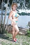 Fatty granny with big boobs stripping off her clothes outdoor