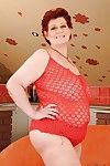 Fatty redhead granny with big flabby tits taking off her lingerie
