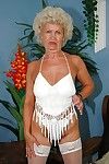 Lustful granny taking off her lingerie and exposing her shaggy muff