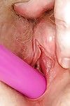 Chubby redhead granny masturbating her unshaven cunt in gyno office