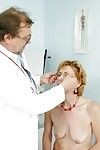 Granny in Glasses strips her ass for a perverted pussy exam by the Doc