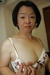 Asian granny Tomoe Nakamachi stripping and taking hairy cunt to shower
