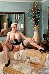 Blonde milf Michelle Barrett in nice fishnet stockings shows the real treasure of big melons