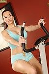 Busty brunette Gabriela Red takes off her uniform and plays with her hairless snatch at the gym