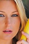Busty blue-eyed blonde Avy Scott has fun masturbating with vegetables and water hose