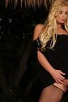 Blonde in black Phoenix Marie shows off her huge tits, juicy buns and snatch in the semi-dark