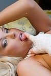Slim blonde Silvia Saint dressed in white bares her small tits and tight pussy