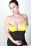Rucca Paige with huge tits and hairy pussy removes her white blouse, black skirt and yellow undies