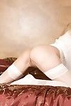 Blonde milf Julia Ann in white blouse and stockings shows her DD\'s and sexy snatch