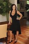Lecherous brunette Lisa Ann strips her black evening gown and shows her big boobs