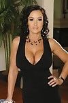 Lecherous brunette Lisa Ann strips her black evening gown and shows her big boobs